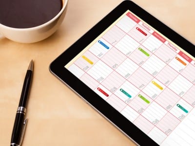 Social media content calendar on a tablet.