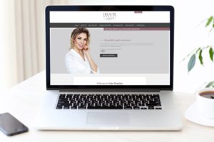 laptop view of Dr. Delaune's new website design