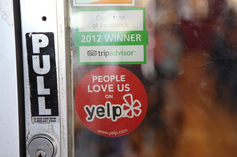"People Love Us On Yelp" sign by Michael Dorausch via Flickr using Creative Commons License (https://www.flickr.com/photos/chiropractic/8246725201)
