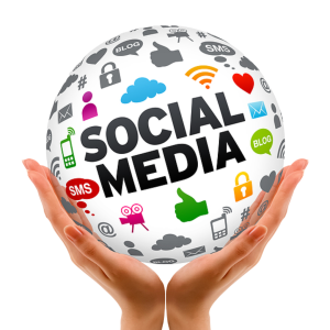 hands holding a globe that says social media and has different social media icons on it